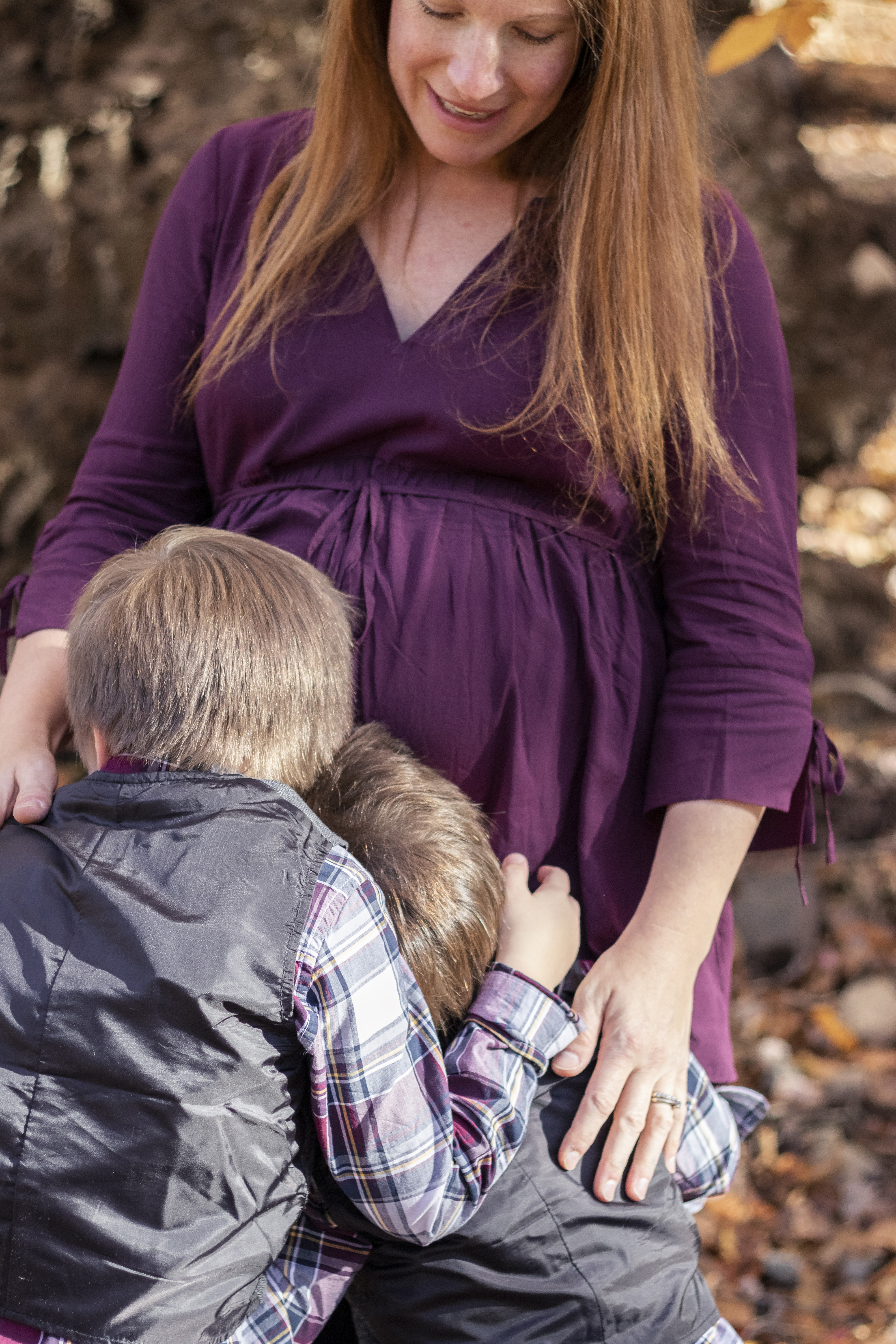Fall Family Portrait of young boys hugging and kissing pregnant mother's belly in Hillsdale, New Jersey by Jaimee Rae Photography