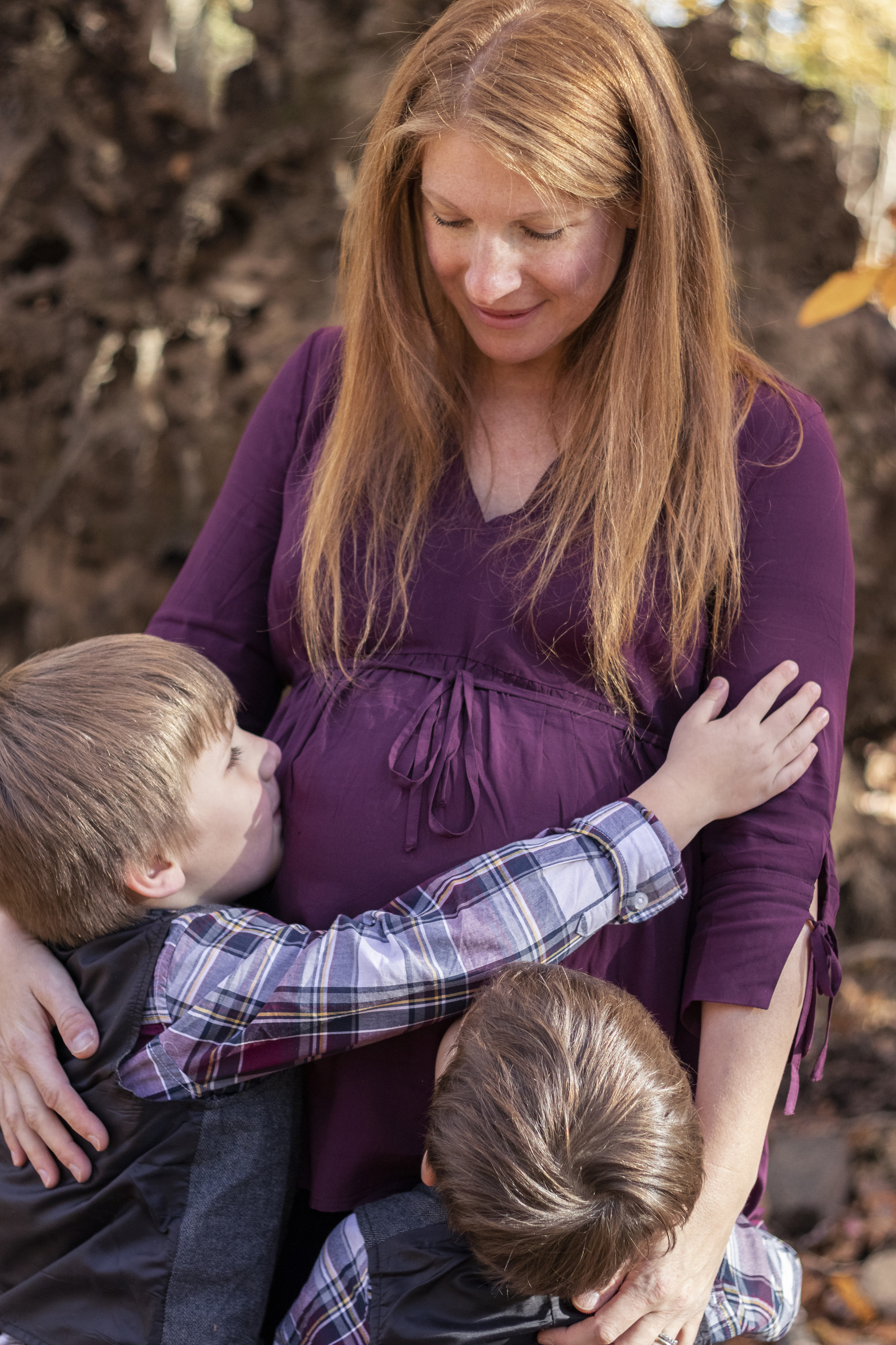 Fall Family Portrait of young boys hugging and kissing pregnant mother's belly in Hillsdale, New Jersey by Jaimee Rae Photography