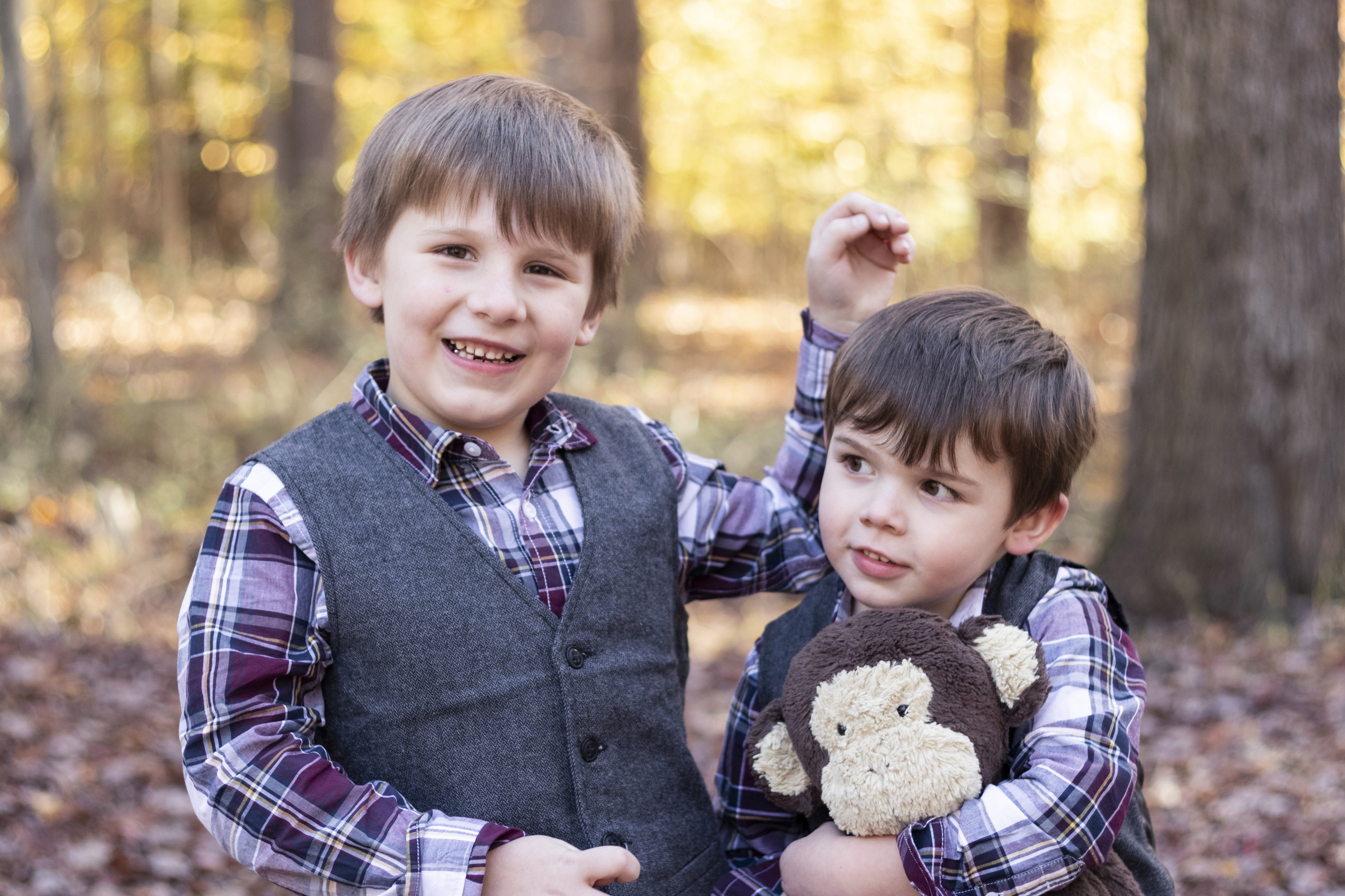 Playful Fall Family Portrait with two brothers and their stuffed animal in Hillsdale, New Jersey by Jaimee Rae Photography