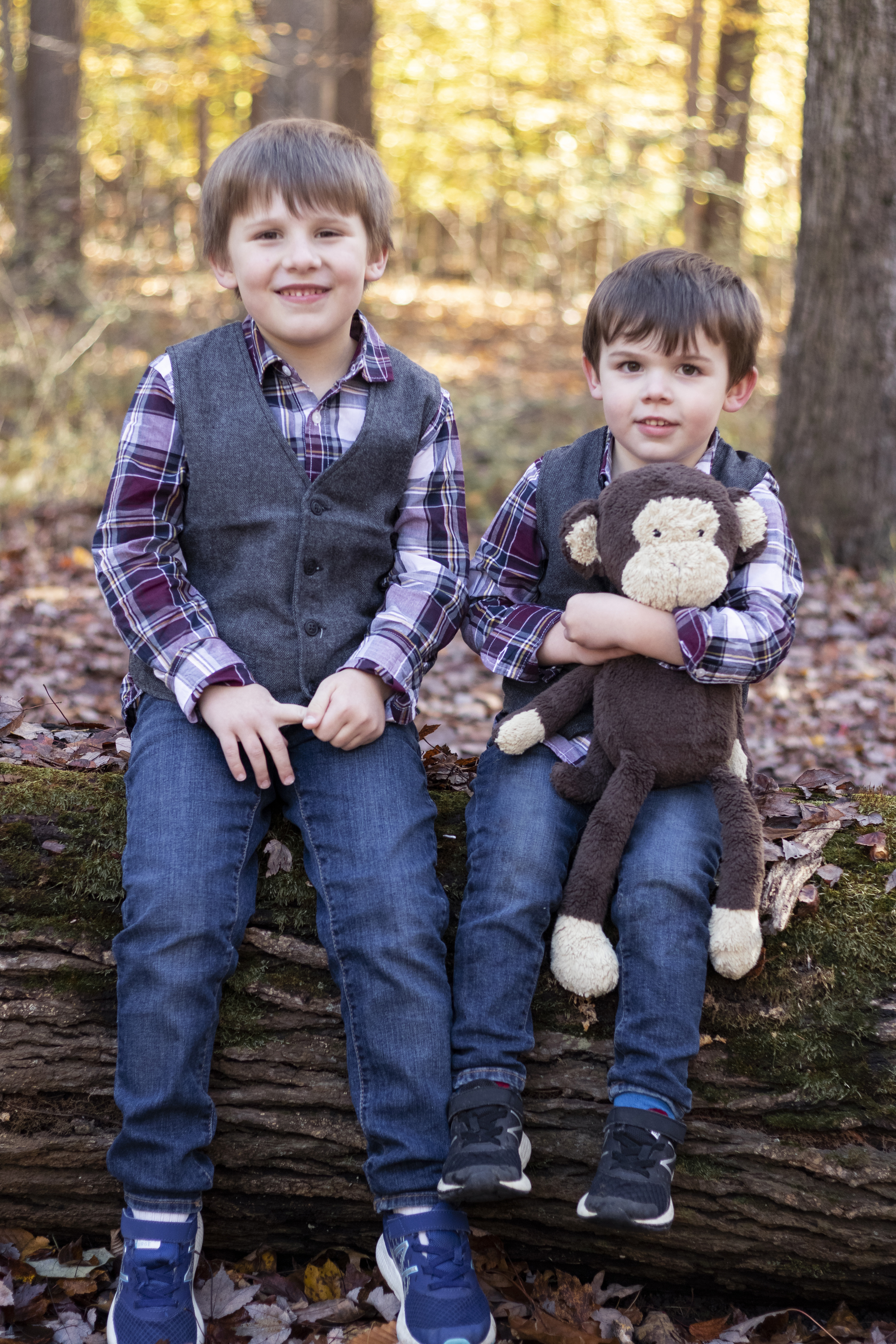 Playful Fall Family Portrait with two brothers and their stuffed animal in Hillsdale, New Jersey by Jaimee Rae Photography
