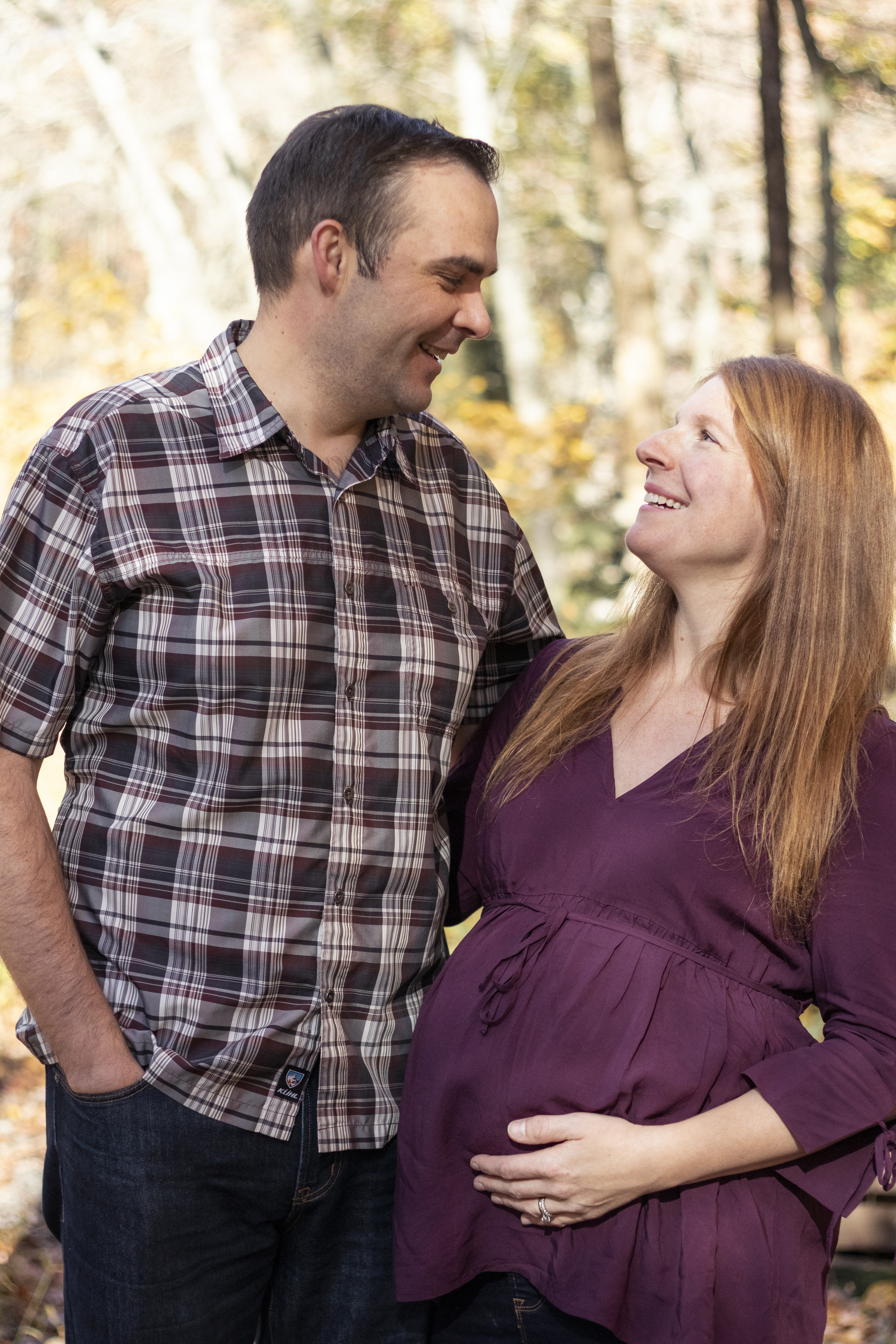 Fall Family Portrait of expectant parents hugging in Hillsdale, New Jersey by Jaimee Rae Photography